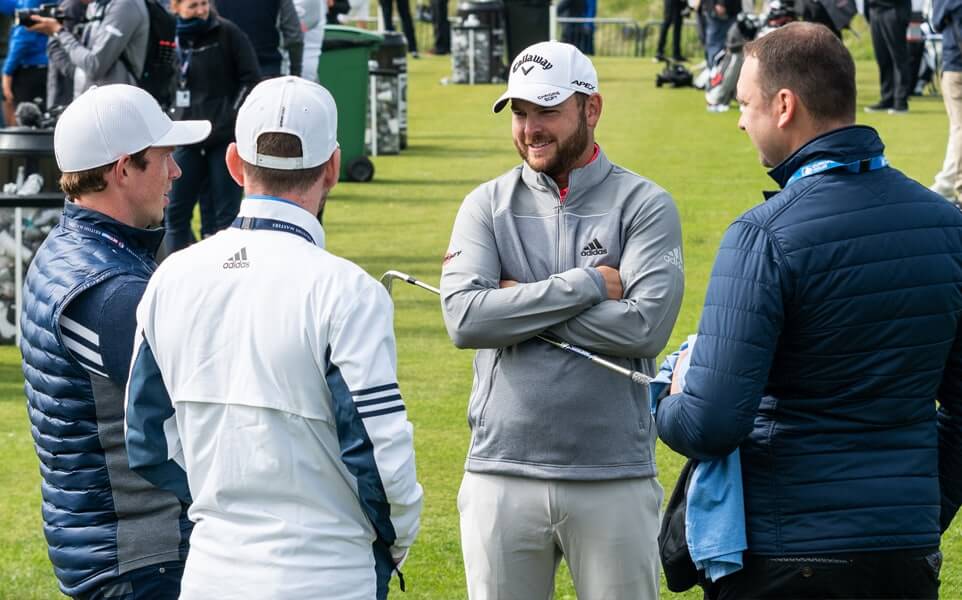 group of golfers talking